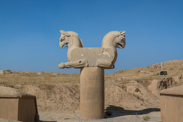 Stone statue of Zoomorphic griffin (Twin Homa or Huma bird figures) in the Persepolis in Shiraz, Iran. The ceremonial capital of the Achaemenid Empire. UNESCO World Heritage