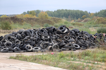 Old tyres polluting the nature. Lithuania. Kedainiai