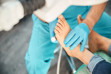 Professional medical pedicure procedure while doctor using nail instrument