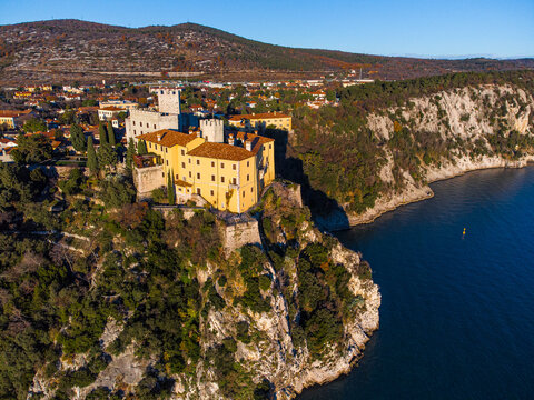 Aerial view of gothic Duino castle on a cliff over the Gulf of Trieste , Italy. 