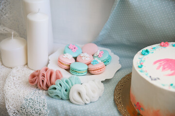 pink and turquoise macaroons and delicate jewelry made of chiffon.