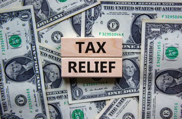 Tax relief symbol. Concept words 'tax relief' on wooden blocks on a beautiful background from...