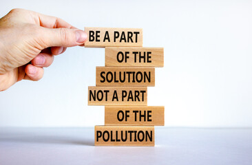 Solution not pollution symbol. Wooden blocks with words 'Be a part of the solution not a part of the pollution'. Beautiful white background. Copy space. Ecological and solution not pollution concept.