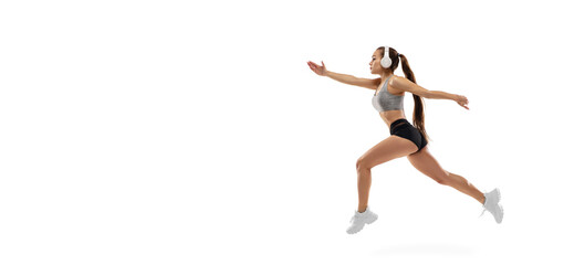 Fototapeta na wymiar Flyer. Caucasian professional female athlete, runner training isolated on white studio background. Muscular, sportive woman. Concept of action, motion, youth, healthy lifestyle. Copyspace for ad.