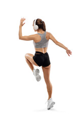 Inspired. Caucasian professional female athlete, runner training isolated on white studio background. Muscular, sportive woman. Concept of action, motion, youth, healthy lifestyle. Copyspace for ad.