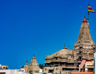 The Temple at Dwarka, dedicated to the Hindu Deity, Lord Krishna, was built in the 15/16th century. The  Temple tower has exquisite carvings with a painted flag  depicting images of the sun and moon  
