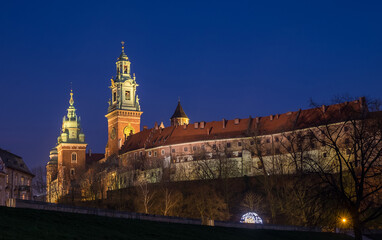 Fototapeta na wymiar Old Krakow famous Wawel Royal Castle landmark twilight image in the Poland. Traveling concept image.