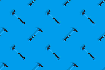 Hammer on a blue background. Hammer seamless pattern.