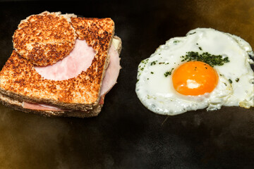 mixed ham and cheese sandwich with egg grilled