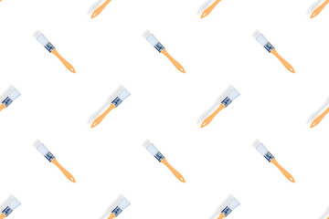 Construction brushes on a white background. Seamless texture from construction brushes.
