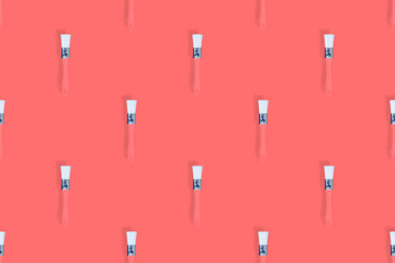 Construction brushes on a red background. Seamless texture from construction brushes.