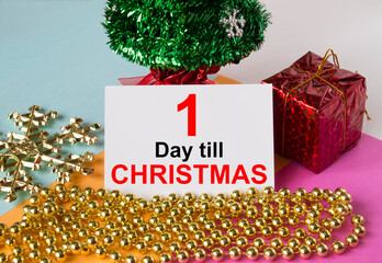 Christmas tree decorated with toys and tinsel, gift boxes and greeting card with text 1 Days till...