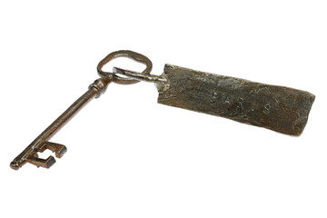 vintage hand-forged key with fob ‘PARIS’ isolated on white background