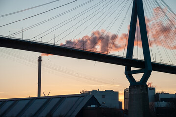 Hamburg, Germany: Pylon of the Koehlbrand Bridge in Hamburg in the ligth of the sunset