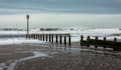A stormy, cloudy and blustery day at Blyth beach in Northumberland, as the waves batter the coast