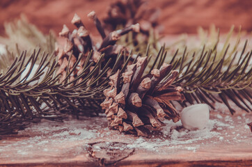 Christmas cones and branches on wooden marshmallow boards