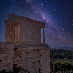 Greece, Athena Nike ancient temple and Athens aerial view from acropolis illuminated by starry...