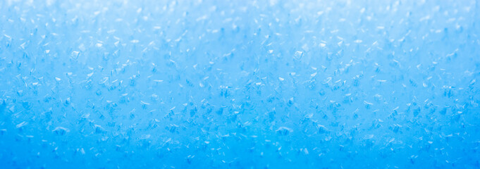 Fototapeta na wymiar Blauer Unscharfer Hintergrund aus Eiskristallen
