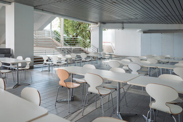 The white food park, food court dining place in the lonely shopping mall was abandoned as the Covid-19 virus concept.