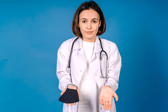 Young Female Doctor In Medical Mask With No Idea Face