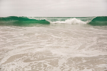 The Pacific Ocean coast in the city of Monterey in California. United States of America. Beautiful beach on a sunny day. Ocean landscape.