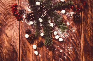 red viburnum. Christmas cones and branches on wooden boards with marshmallows - 401261087