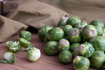 ripe brussels sprouts lie on a wooden table