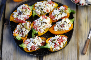 Sweet paprika peppers stuffed with white cheese. Healthy snack. Diet food. Vegetarian meals.
