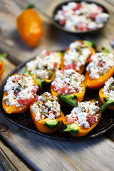 Sweet paprika peppers stuffed with white cheese. Healthy snack. Diet food. Vegetarian meals.