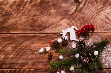red viburnum. Christmas cones and branches on wooden boards with marshmallows - 401263292
