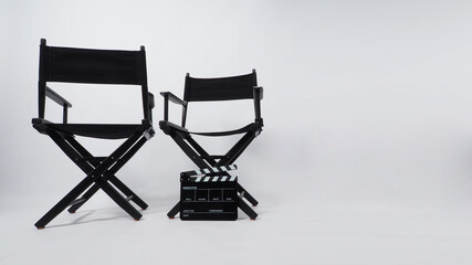 Two black director chair and clapper board or Clapper board or movie slate ,use in video production or movie and cinema industry on white background.