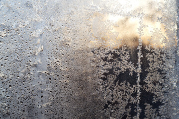 The window glass is frozen. Winter