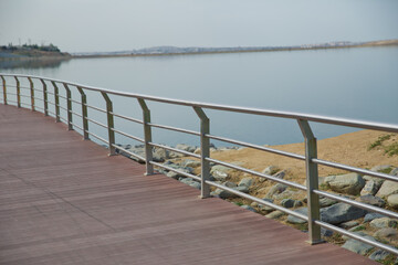 Boyukshor Lake in Baku Azerbaijan . According to geological data, the average depth of the water in the lake is 3.40-3.95 meters . An oval bridge from iron and wood on the edge of the lake .