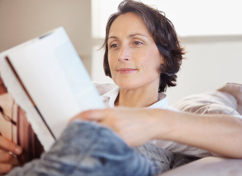 Woman reading on couch