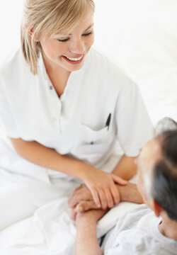 Nurse sitting with patient