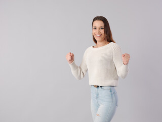 young pretty woman spreading arms with euphoric and winning fitness