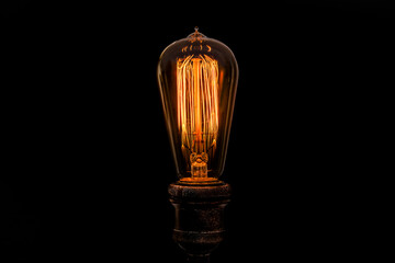 Edison light bulb on black background