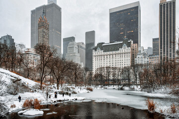 Fototapeta premium New York City - USA - Dec 17 2020: Winter Morning Snow Storm Hits Central Park New York City
