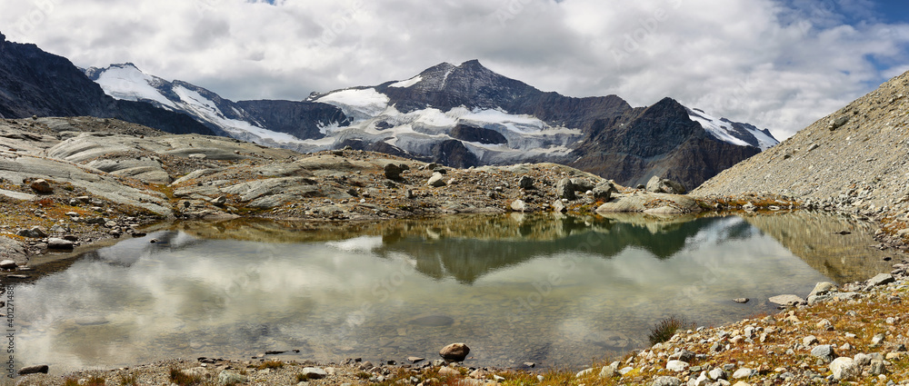 Sticker Glacier du Grand Mean and lagoon with red water foreground, Vanoise national park, France