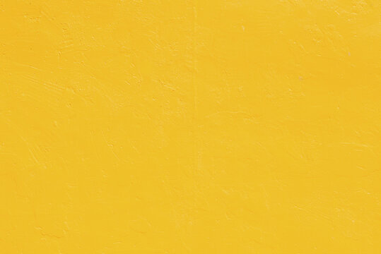 Vivid Yellow Stucco Wall Background. Yellow Painted Cement Wall Background Texture.