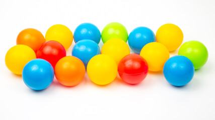 Colored plastic balls on white background. leisure and game items. round objects