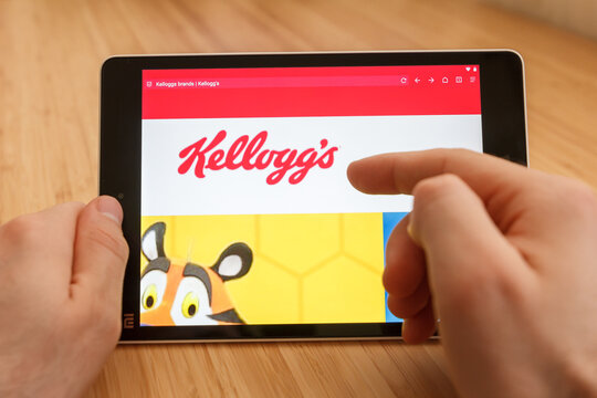 SAN FRANCISCO, US - 1 April 2019: Close up to hands holding tablet using internet and looking through kelloggs web site, in San Francisco, California, USA. An illustrative editorial image.