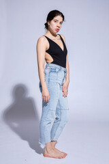 Dark hair caucasian girl on grey