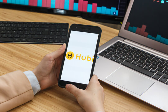 SAN FRANCISCO, US - 18 June 2019: Female Trader Hands Holding the Smartphone Using Application of HUBI Cryptocurrency Exchange Market. 
