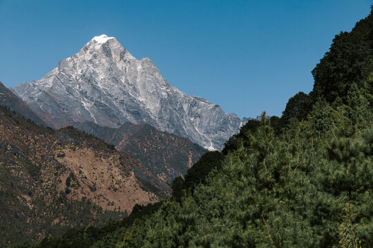 Majestic scenery of desert rough rocky mountainous terrain under blue sky in sunny day