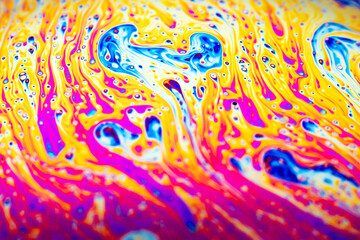 Beautiful psychedelic abstraction formed by light on the surface of a soap bubble