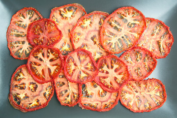 dried tomato slices on a plate. Vitamin vegetable food