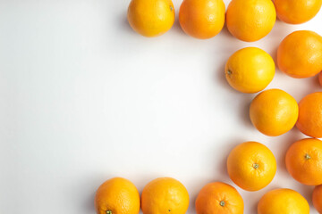fresh and whole oranges are on the table
