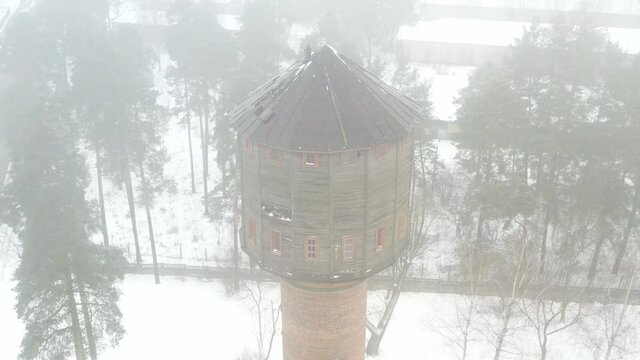 view of the old water tower standing by the road
