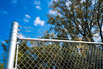 barbed wire fence securing parking